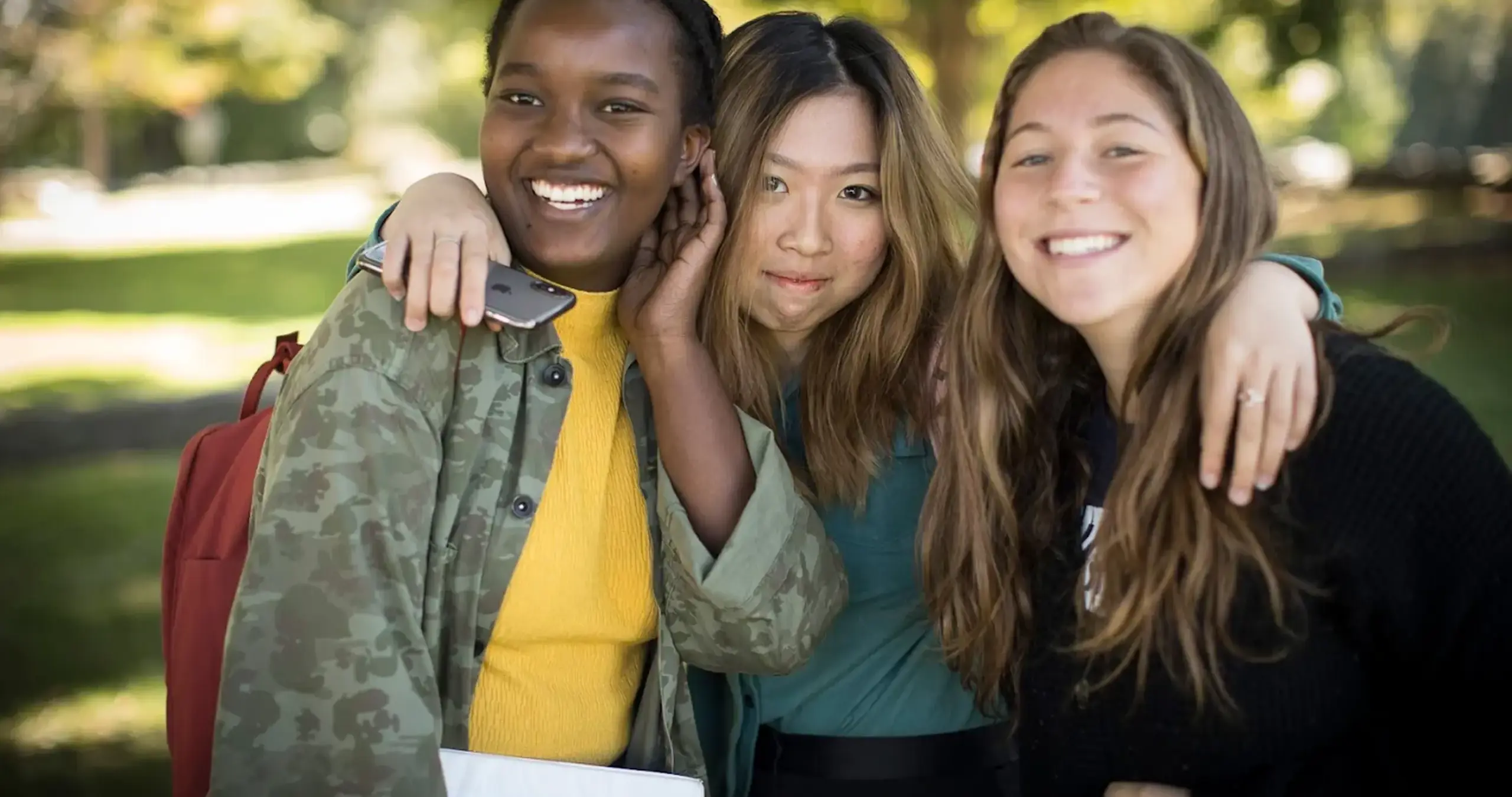 Students hugging and smiling