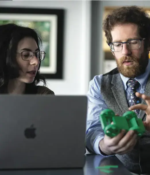 Teacher assisting student in class