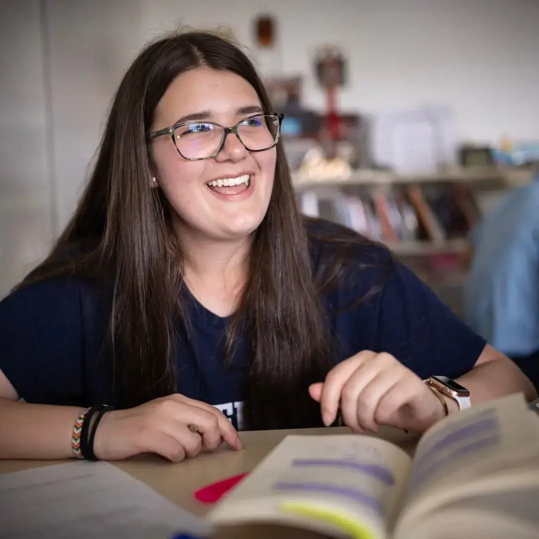 students in class with books