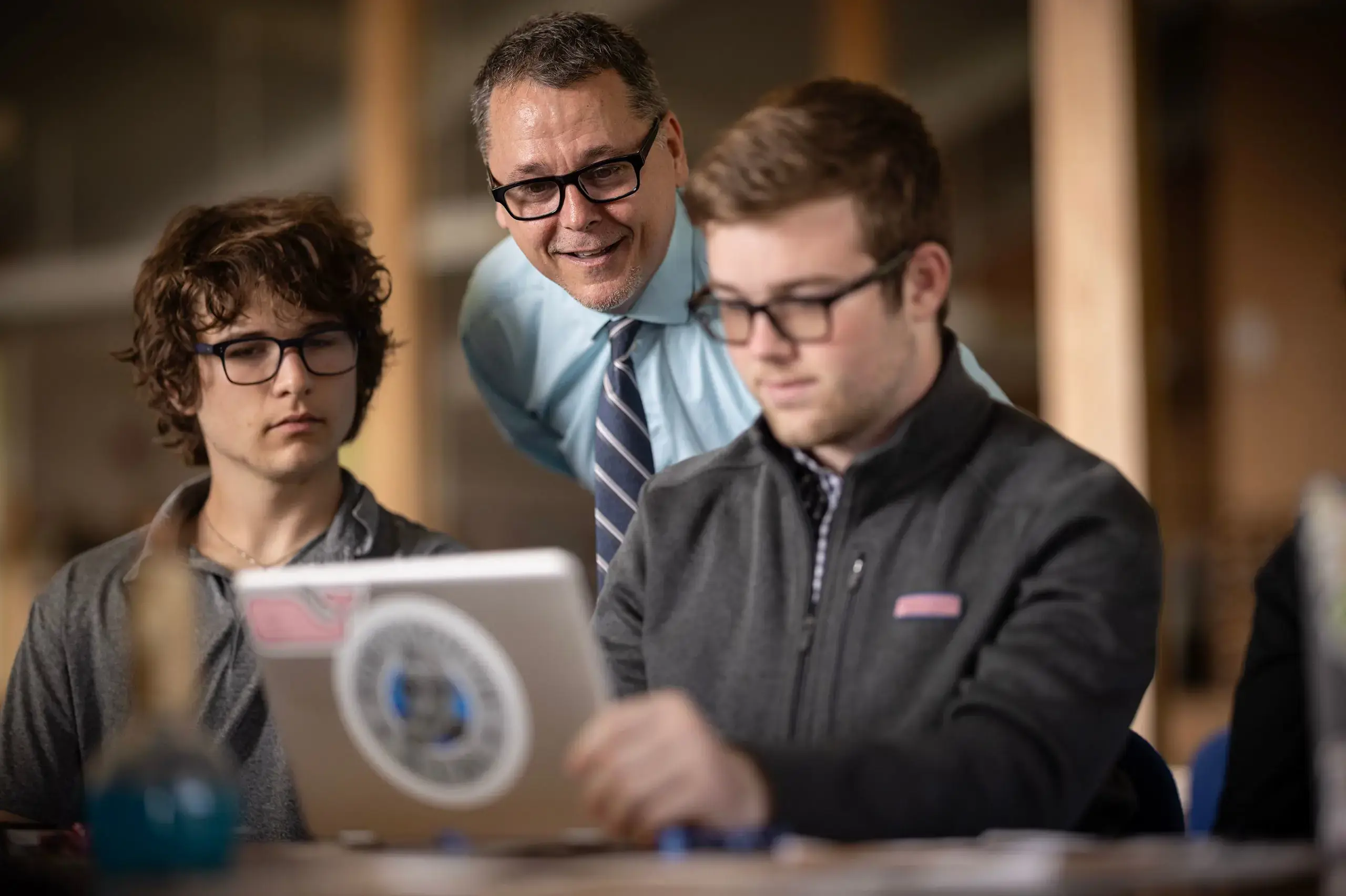 Teacher assisting students in class