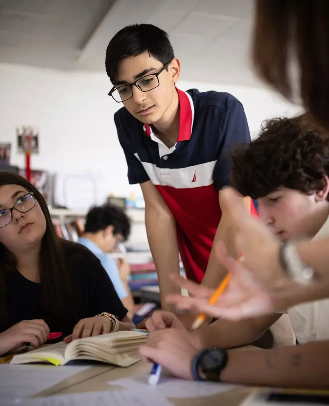 Students listening to teacher in class