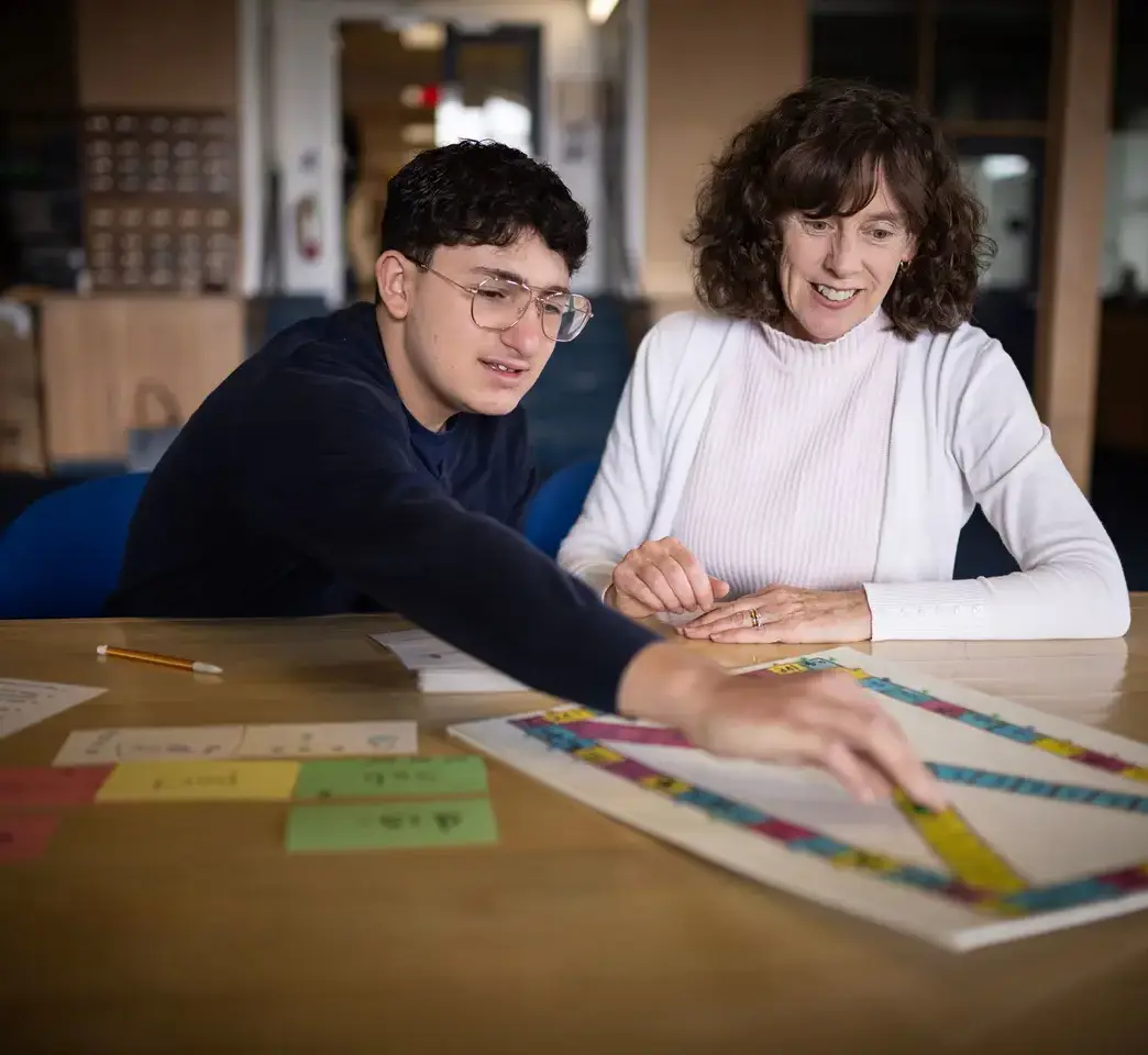 Student and teacher in library 