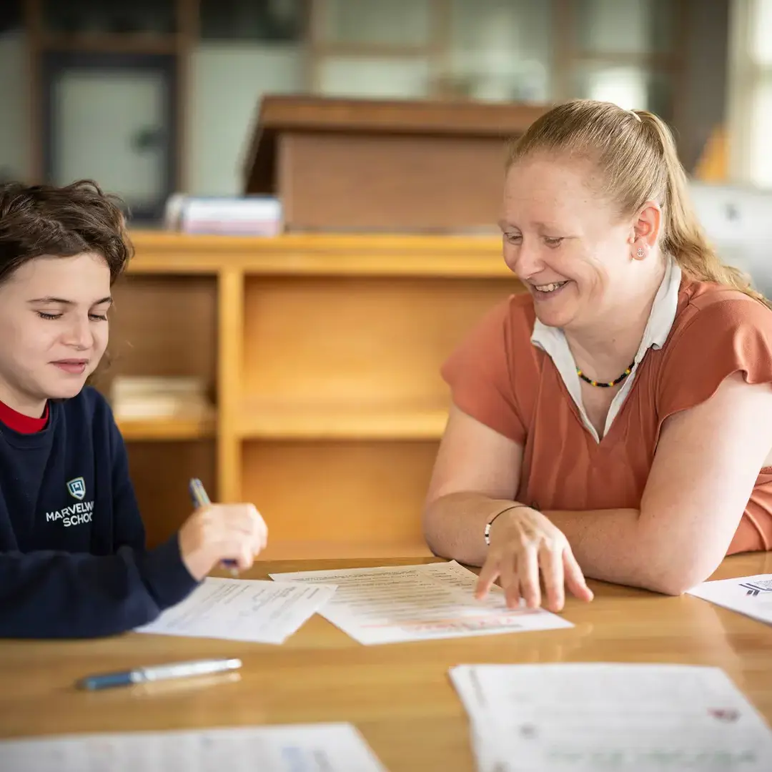Student and tutor in library together