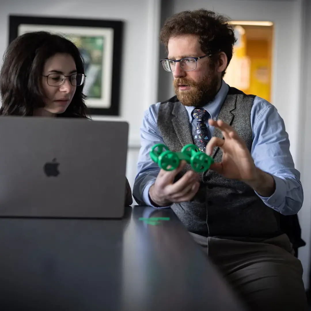 Student and teacher in science class