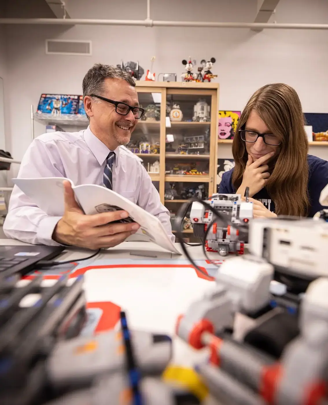 Student and teacher working on science project