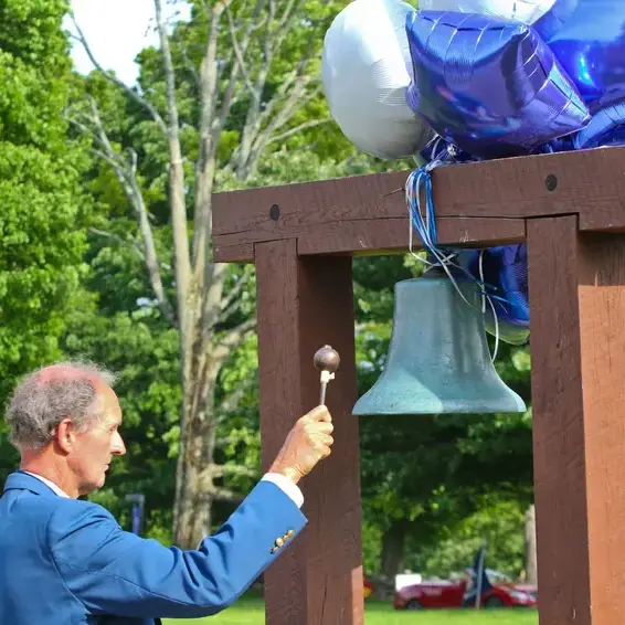 Alumni ringing bell