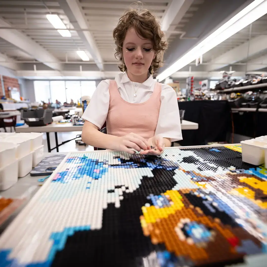Student creating lego painting