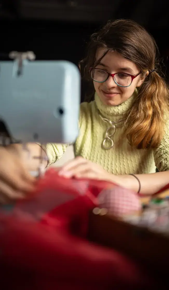 Student doing sewing project