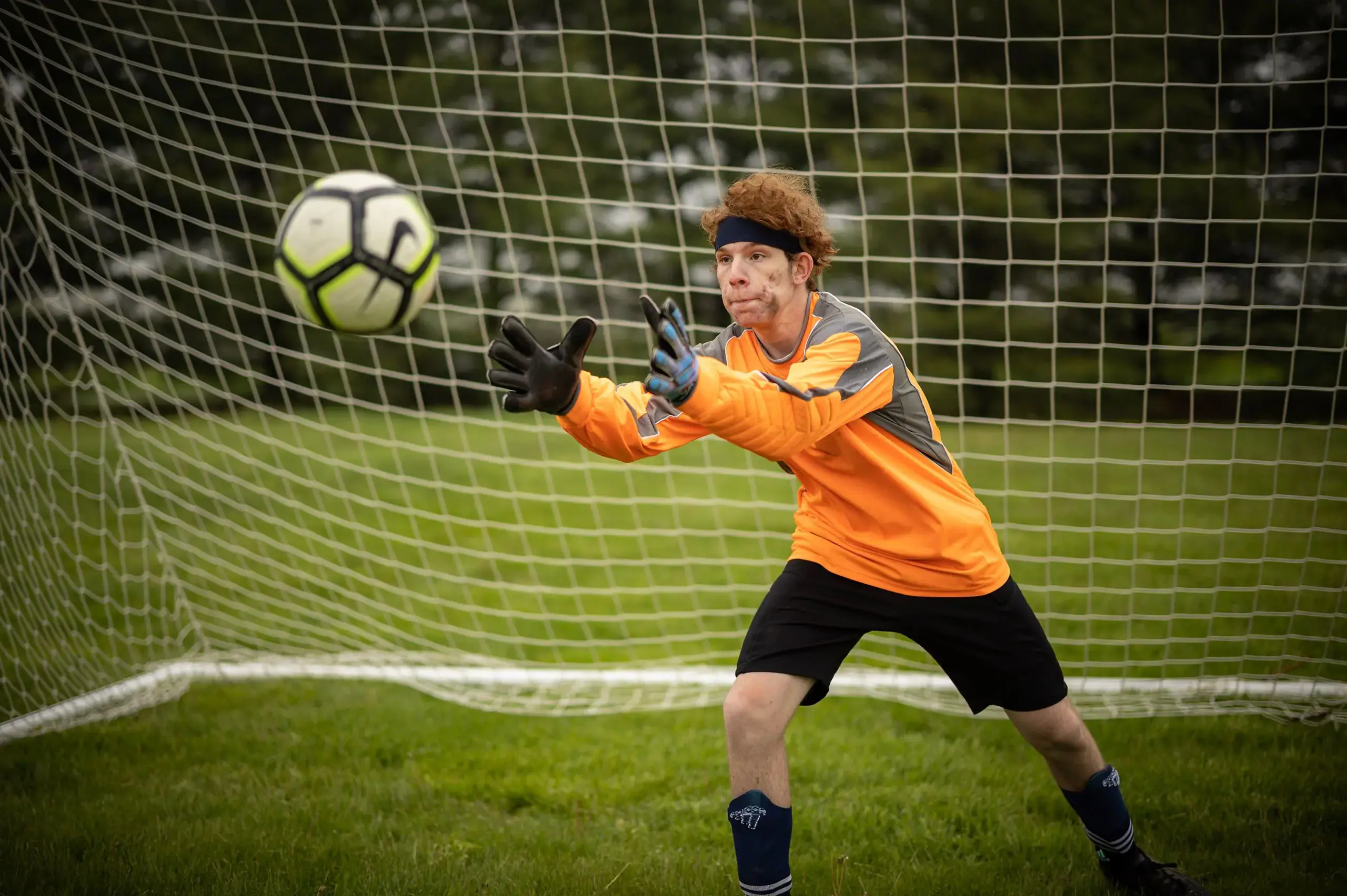 Student playing soccer