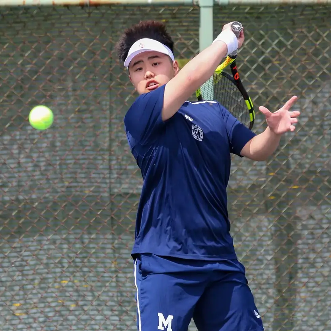 Student Playing Tennis