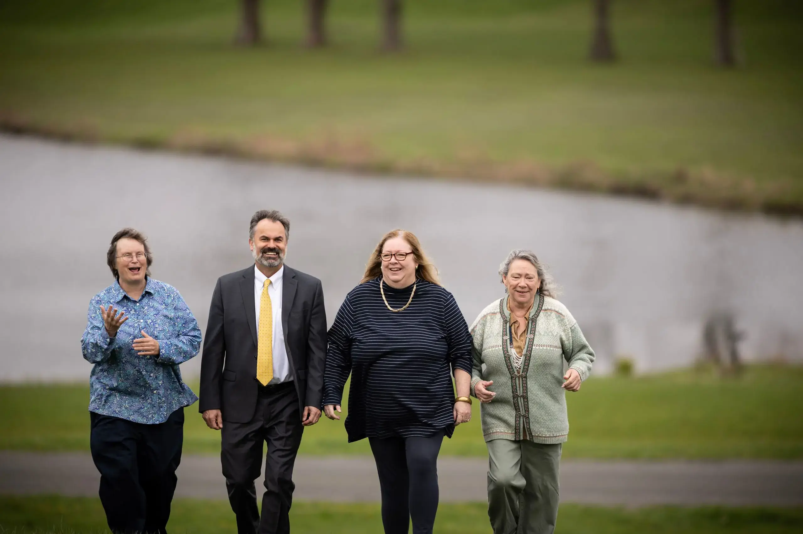 Staff walking by lakeside