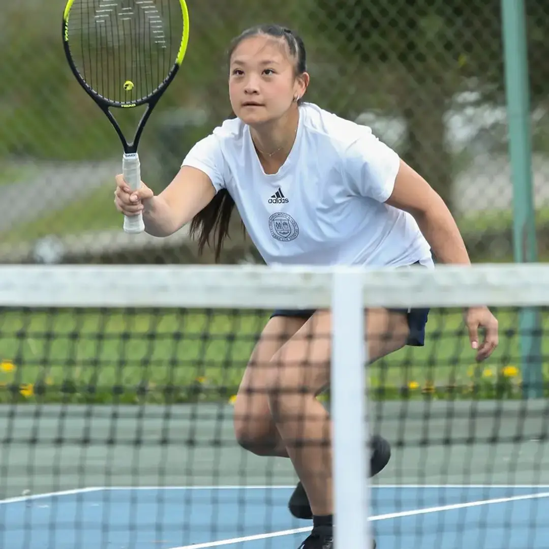 Student playing Tennis