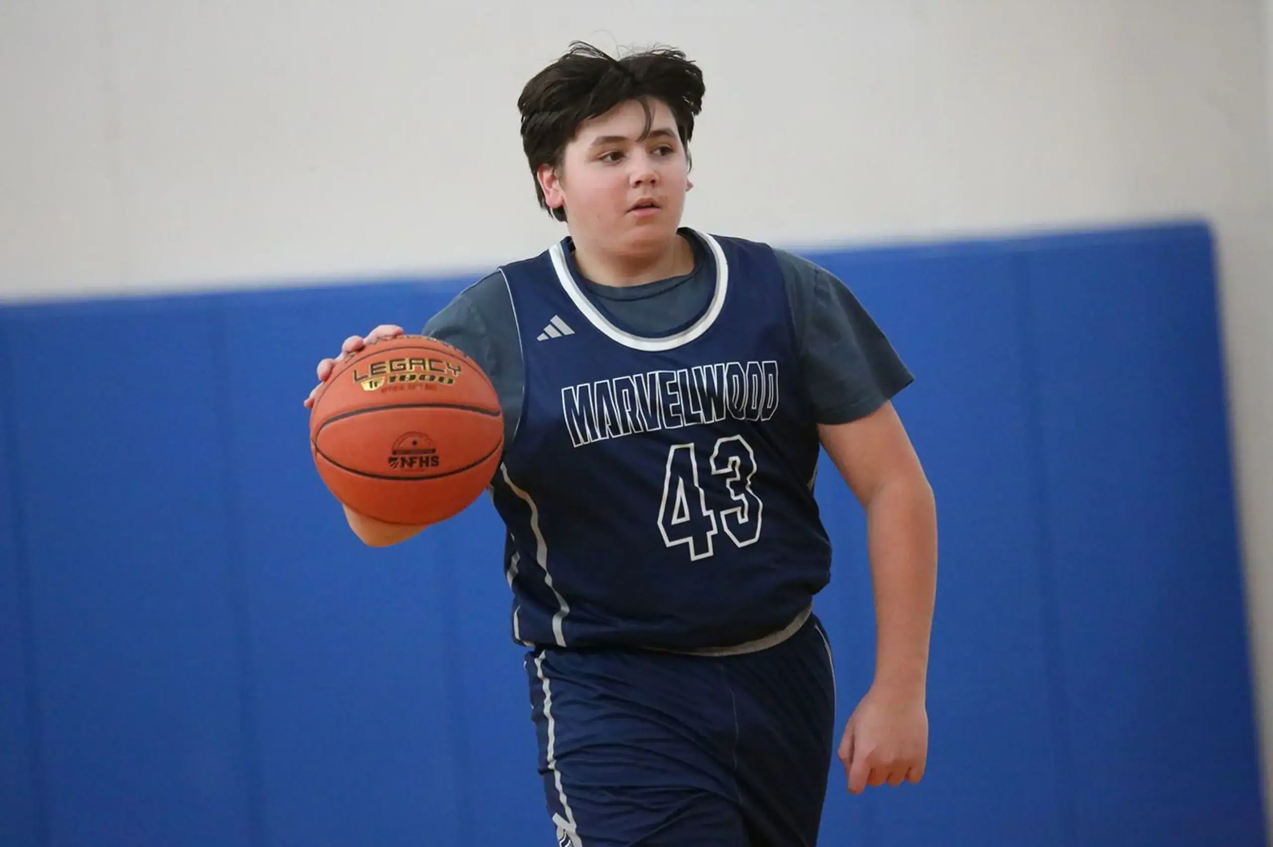 Student playing basketball