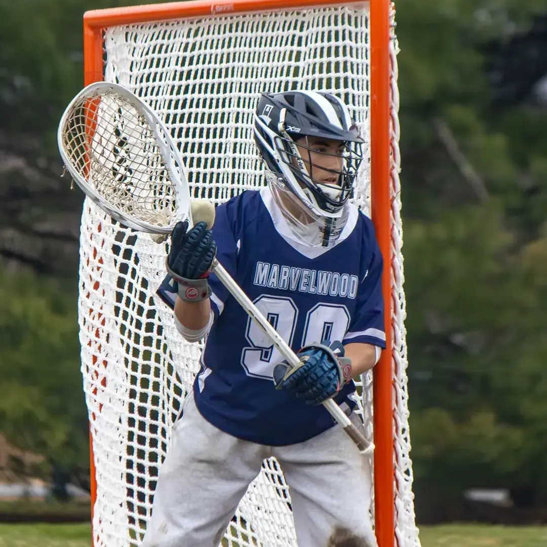 Student Playing Lacrosse