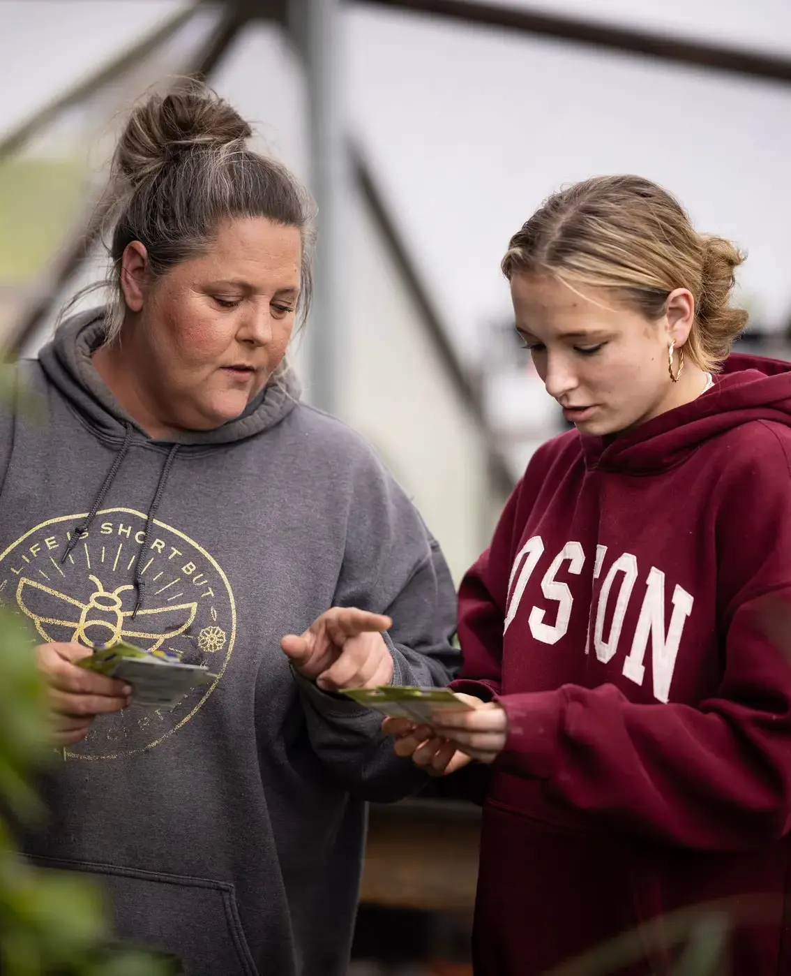 Teacher and student gardening together