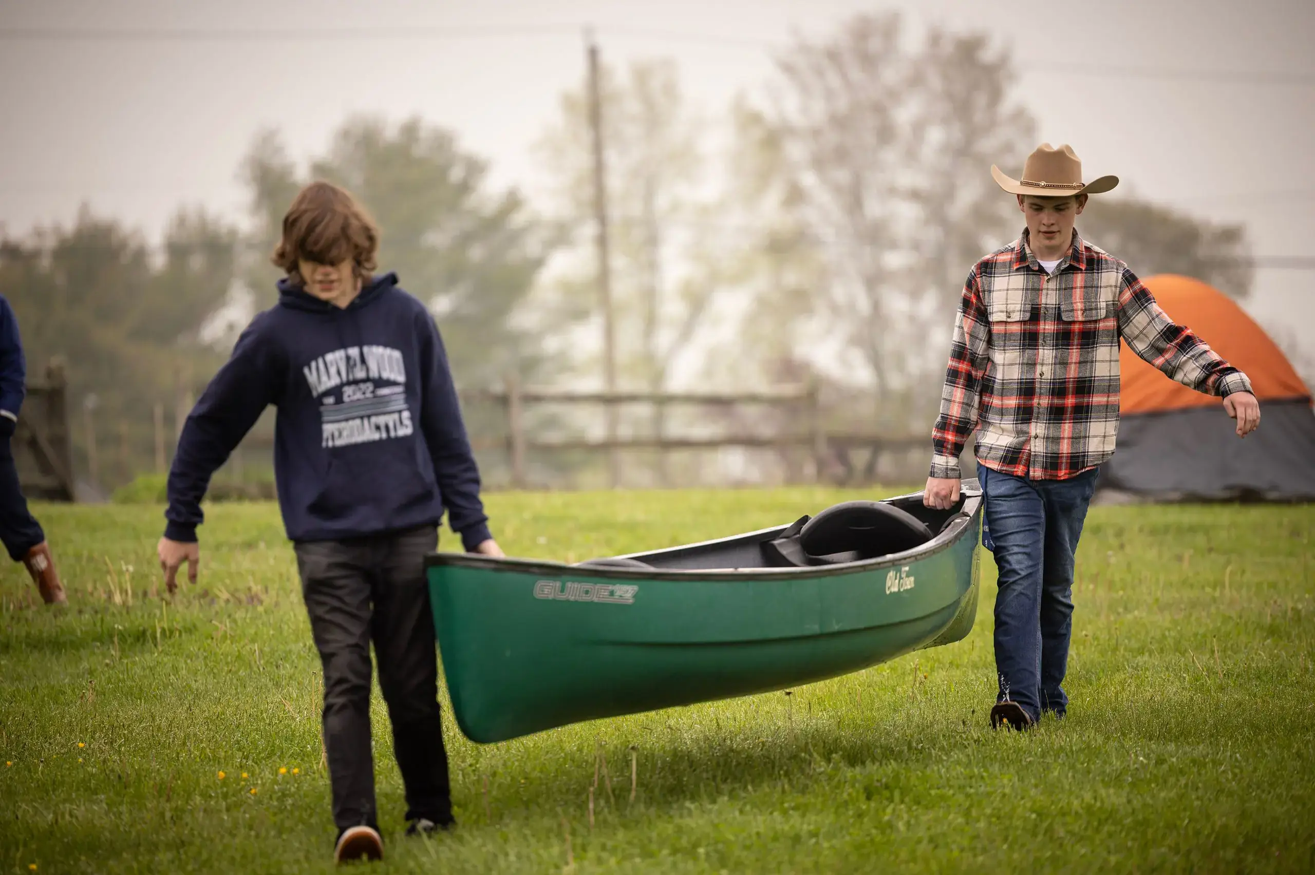 Students carrying canoe
