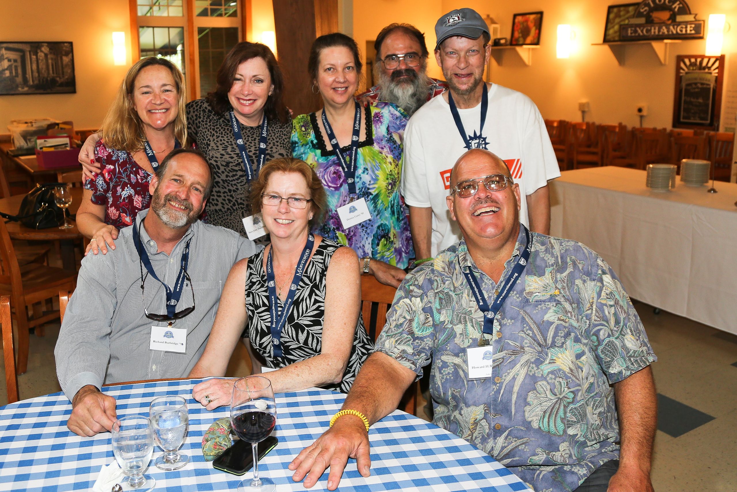 Alumni at alumni event smiling