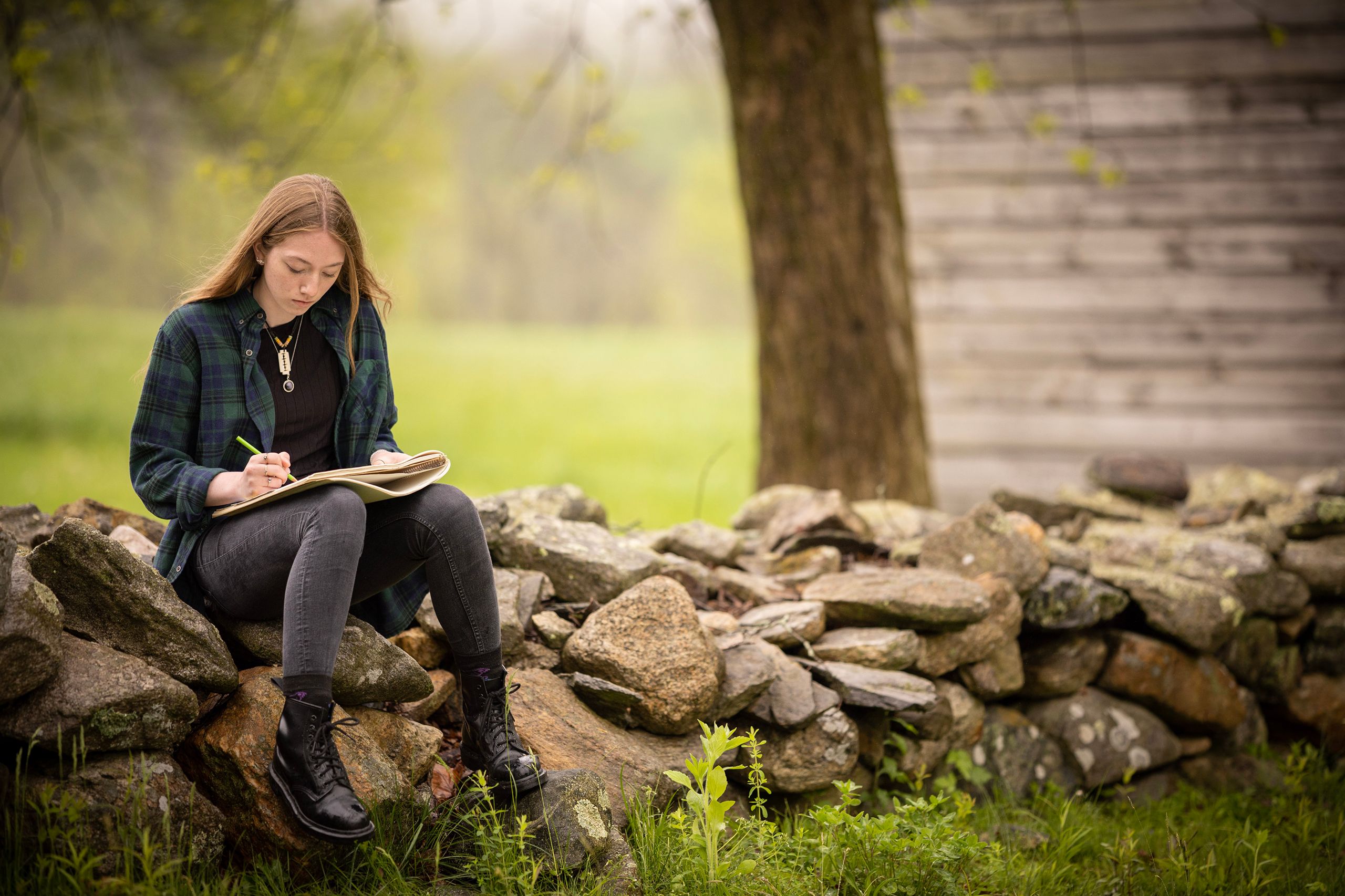 Student drawing outside