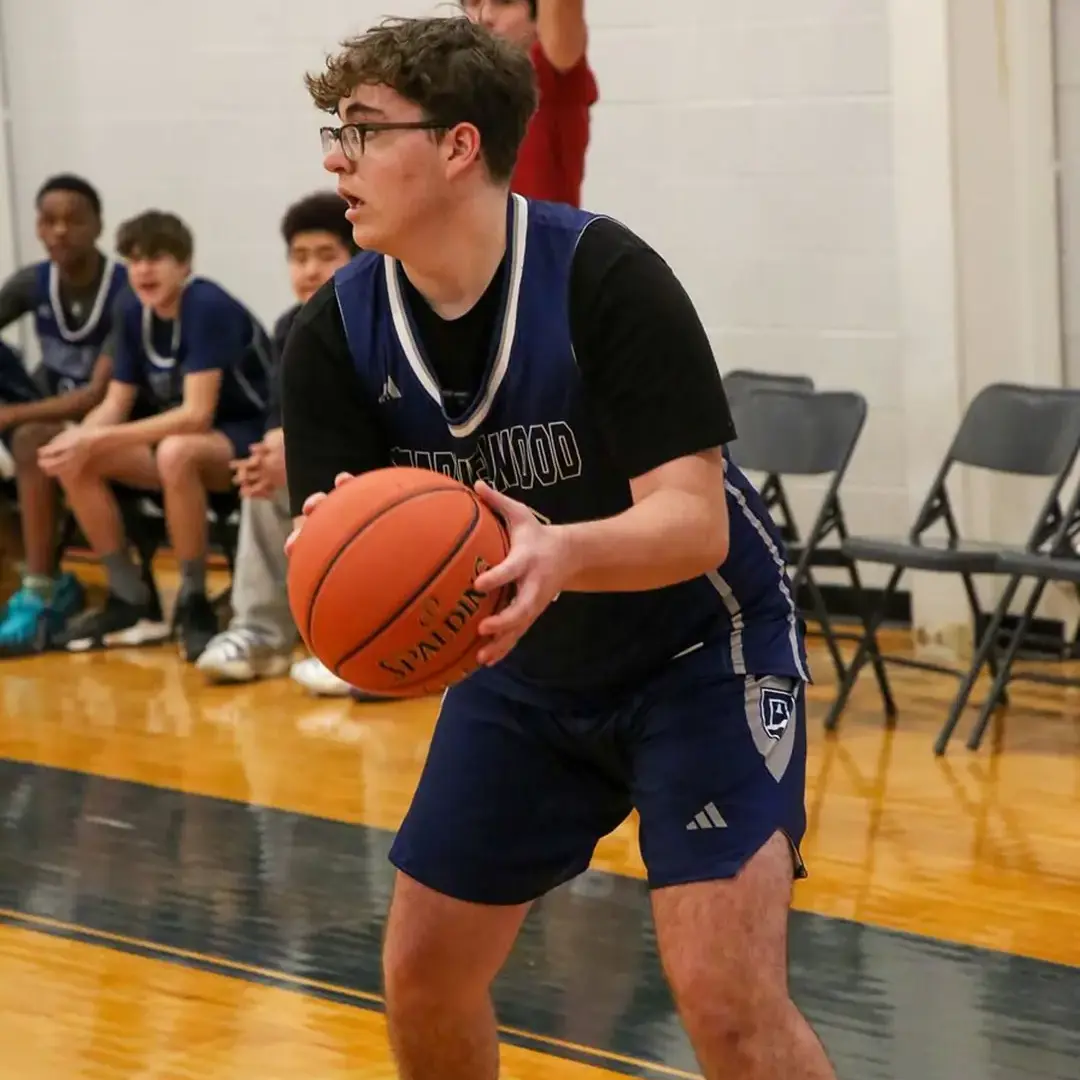 Student playing basketball