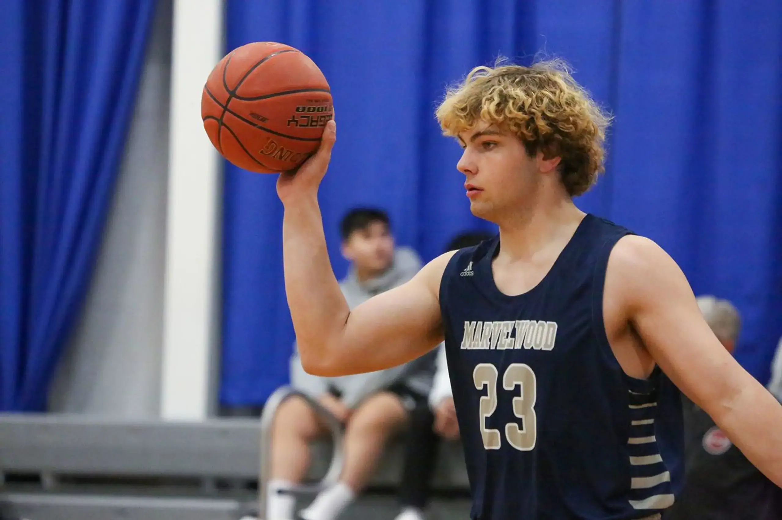 Student playing basketball