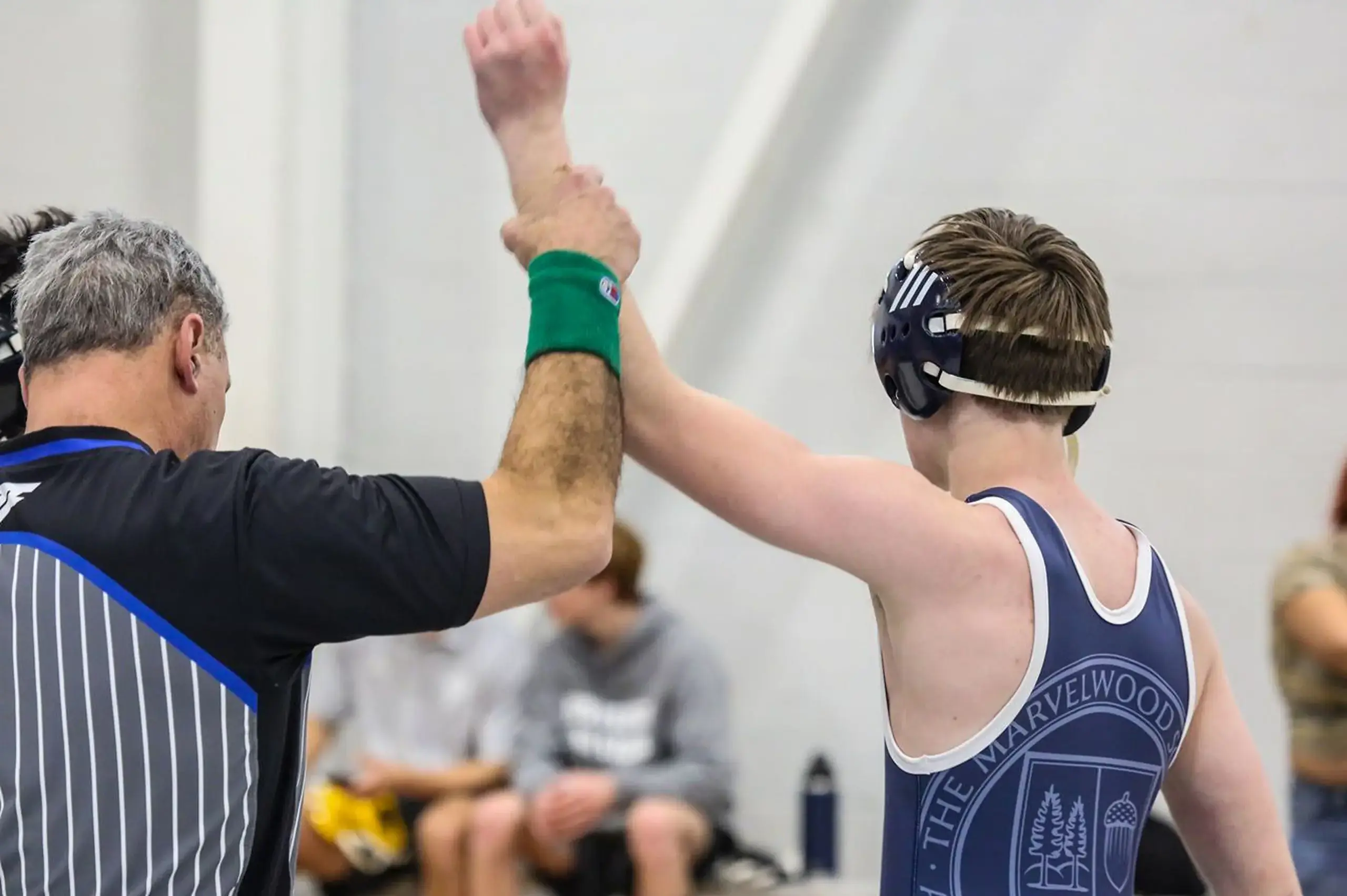 Student wrestler celebrating victory