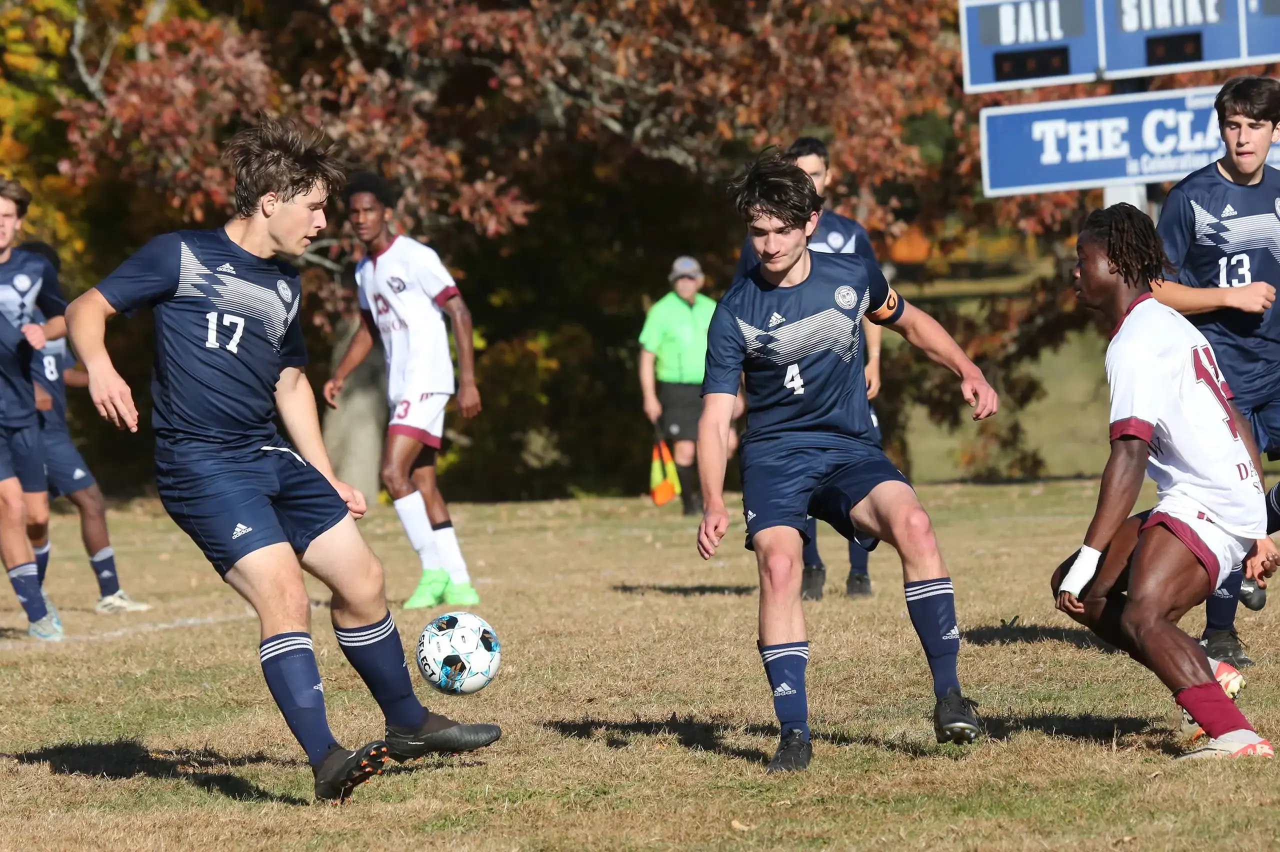Male students playing soccer